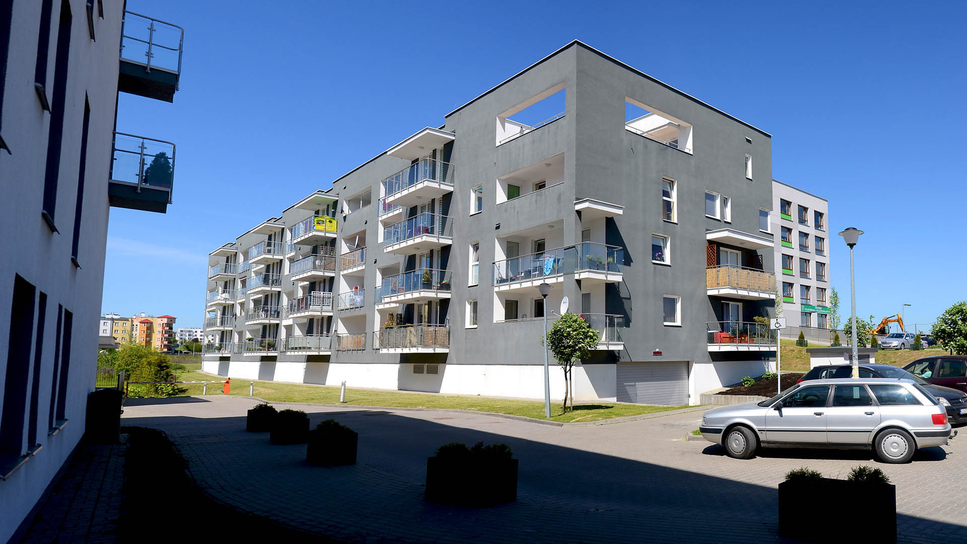 Nowe osiedle inwestycyjne. Nowoczesne, szare bloki. Nowe mieszkania na sprzedaż w Lublinie.
